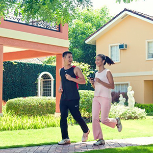 A man and a woman jogging on Camella Homes Cavite.